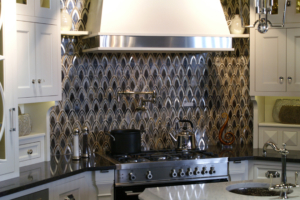 mirrored tile kitchen backsplash