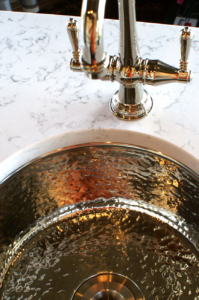 hammered nickel sink in quartz countertop