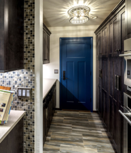 New Blue Door to garage flanked by our custom cabinetry