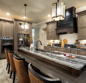 Natural rift oak cabinets with a mitered doors and a flat black venthood