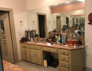 BEFORE - old vanities and carpeted floor!