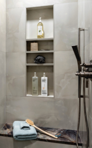 Master shower redesign with quartzite seating and large format porcelain tiles.