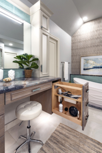 Floating vanity with integrated styling accessory pull-out