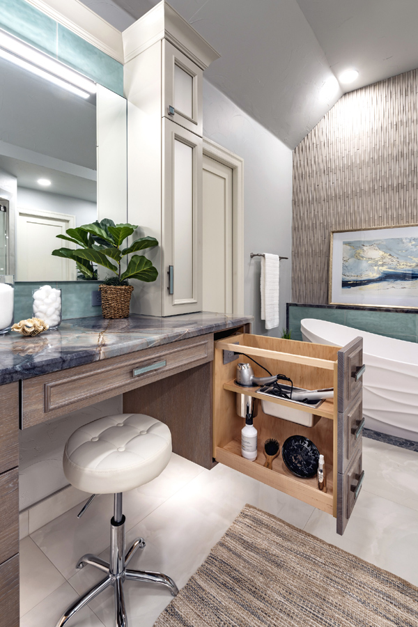 Floating vanity with integrated styling accessory pull-out