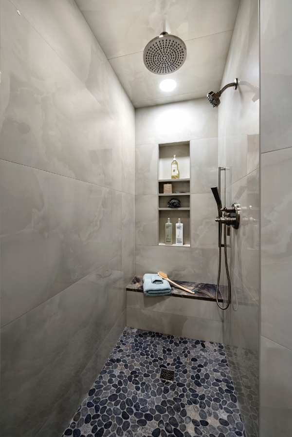 Curbless walk-in shower with quartzite seating