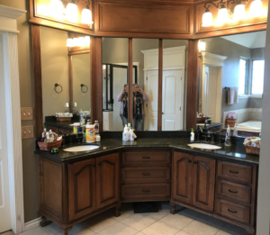 BEFORE corner vanity with builders grade cabinet and finish