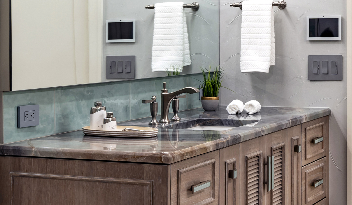 Close up details of the custom floating vanities with quartzite top.