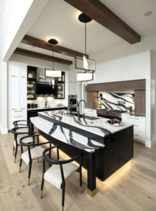 Custom Island with Galley Workstation 5, Cambria, and toe kick lighting.