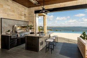 Patio kitchen on the lake created with our weatherproof cabinetry