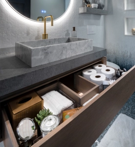 Custom floating vanity with wrap around drawer in this new bathroom