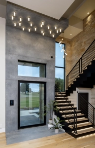 Custom ceiling lighting created with quartz slabs for this new home entry