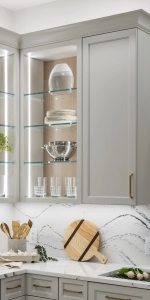 Glass shelving inside the open cabinetry.