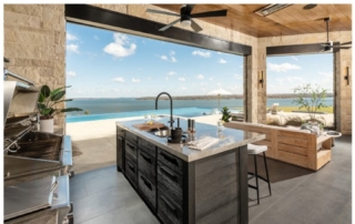 Patio kitchen with custom cabinetry overlooking Lake Kaw in Oklahoma.