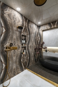 Stunning book matched stone created for this bathroom redesign
