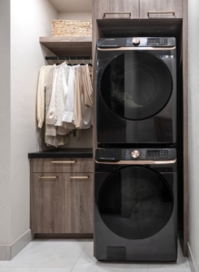 Stacked washer and dryer integrated into this closet design