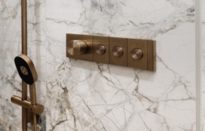 Kohler's bronze shower valve system and sliding rod used for this bathroom renovation