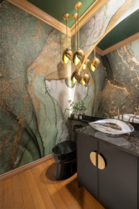 Stunning custom wallpaper print created for this powder bath renovation with curved mirror and high end vanity
