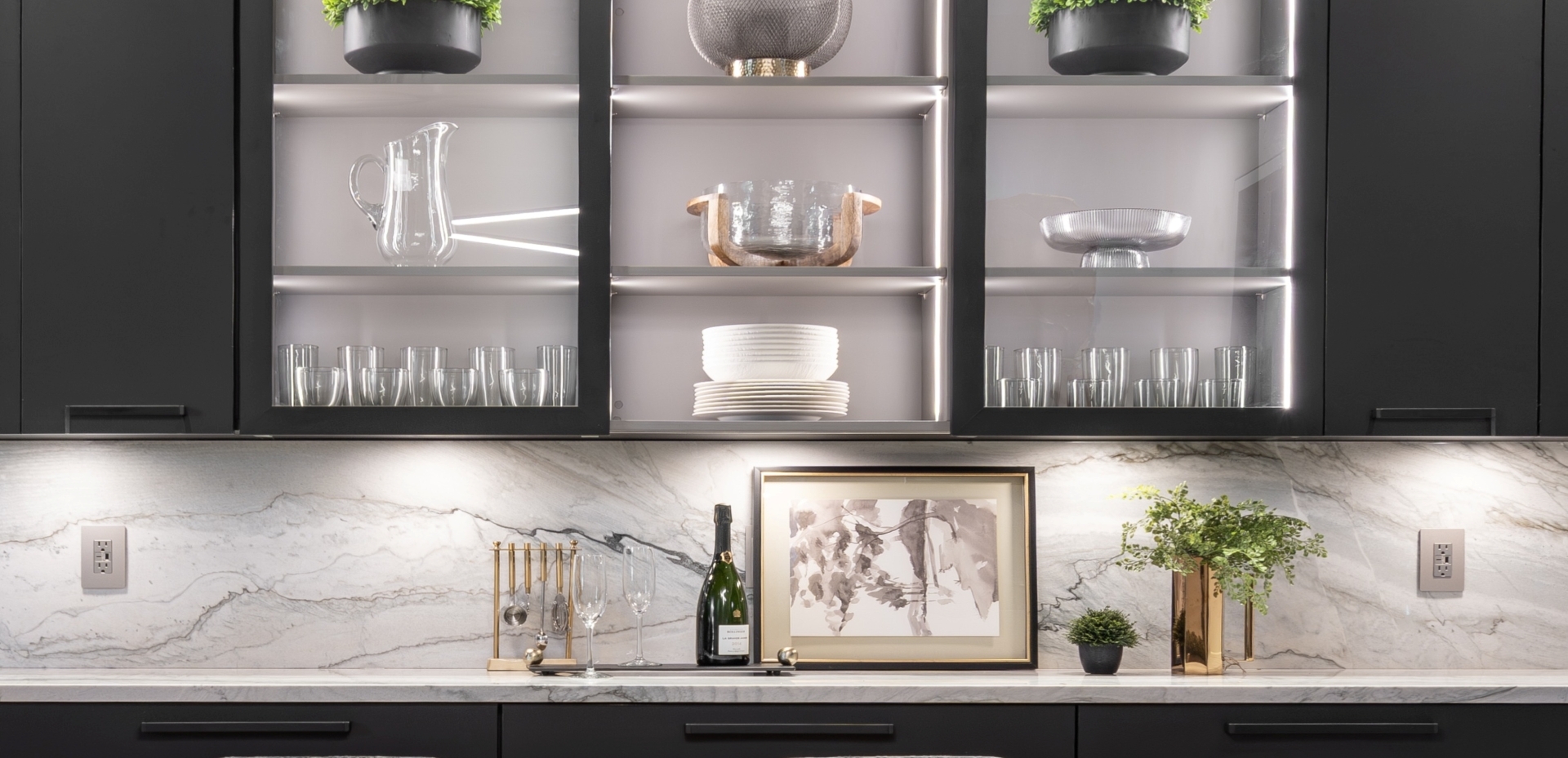 Integrated lighting details in our contemporary custom cabinetry with matte black finish