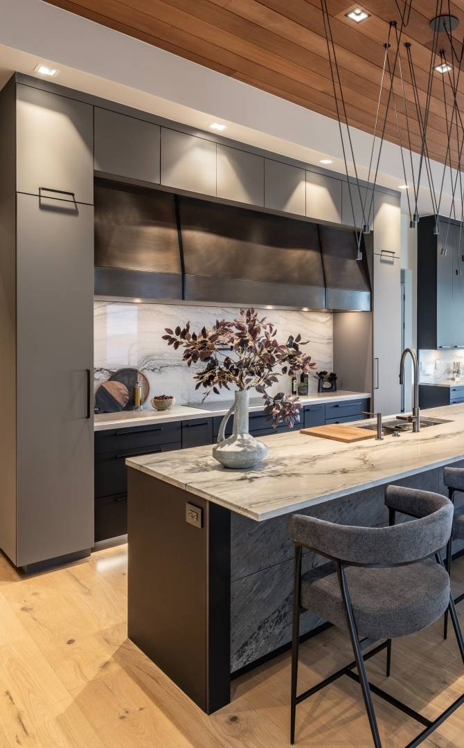 Modern kitchen design with quartzite island and matte finished cabinetry