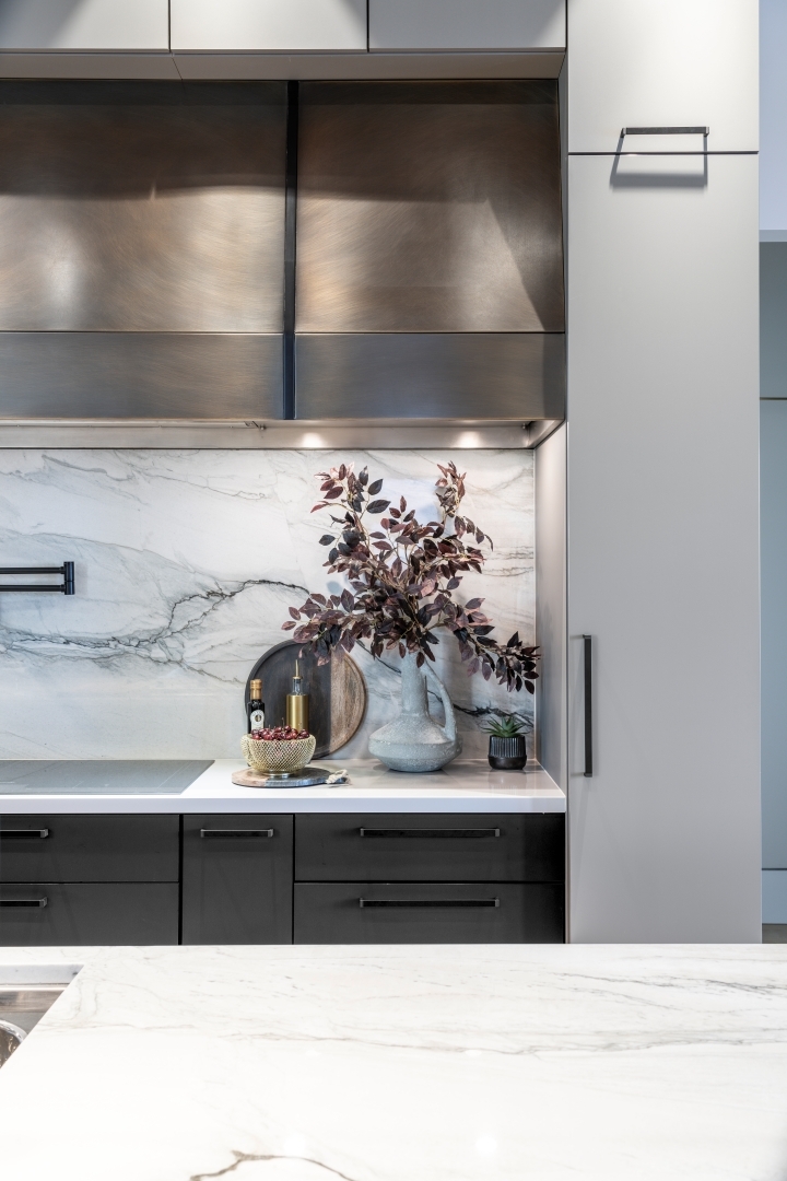 Modern Kitchen Cabinetry with custom made brass venthood