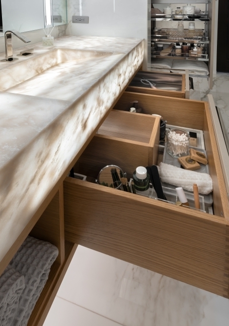 floating vanity with u-shaped drawer and underlit countertop