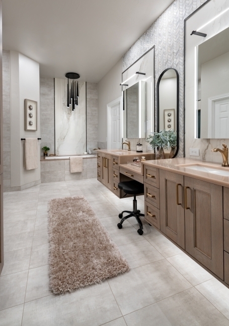 bathroom remodel with floating vanities and luxury bathtub