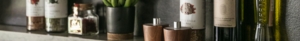 spice and oil shelf on kitchen backsplash