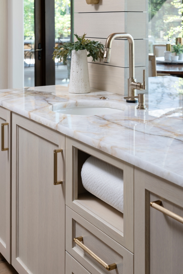 Built in paper towel storage created in the kitchen of this whole home remodel