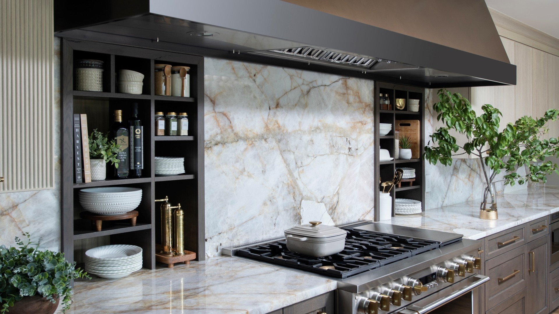 Edmond-kitchen-remodel-custom-venthood-over-wall-niches Integrated shelves in backsplash provide storage adjacent to the cooktop - surrounded by stunning Crystallo Quartzite