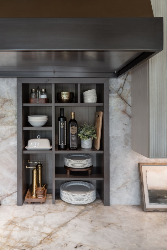 Custom in-wall storage niches created for the kitchen in this whole home remodel
