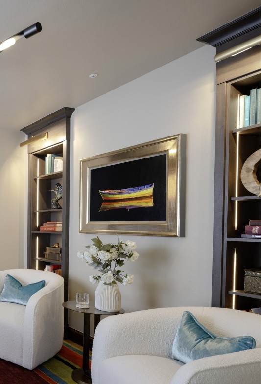 In-Wall custom bookcases with integrated lighting created in this Home Office as part of the whole home remodel