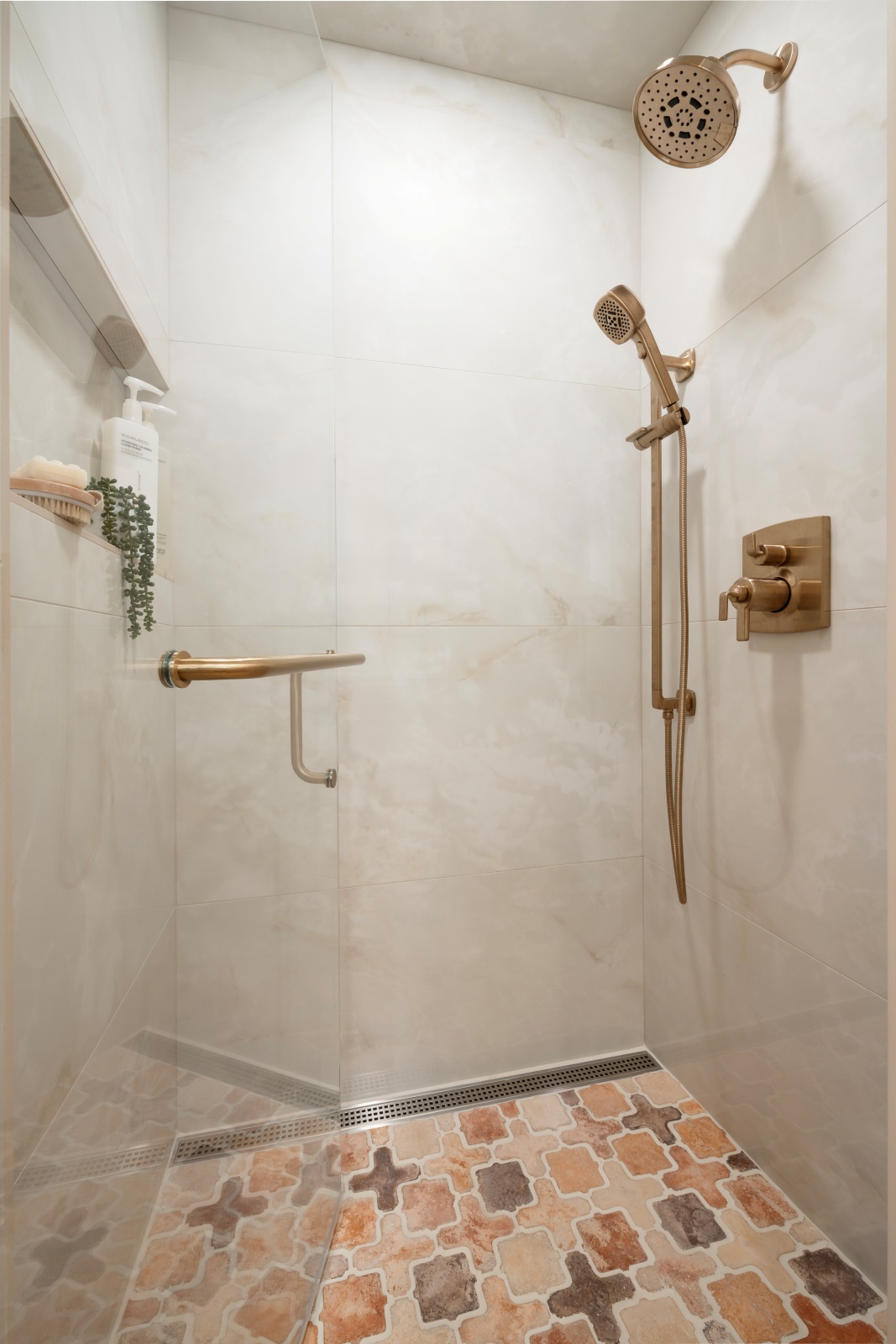 Edmond-guest-bathroom-remodel-custom-shower-with-infinity-niche-and-linear-drain Curbless shower with illuminated niche, tiled bench and patterned concrete bathroom floor