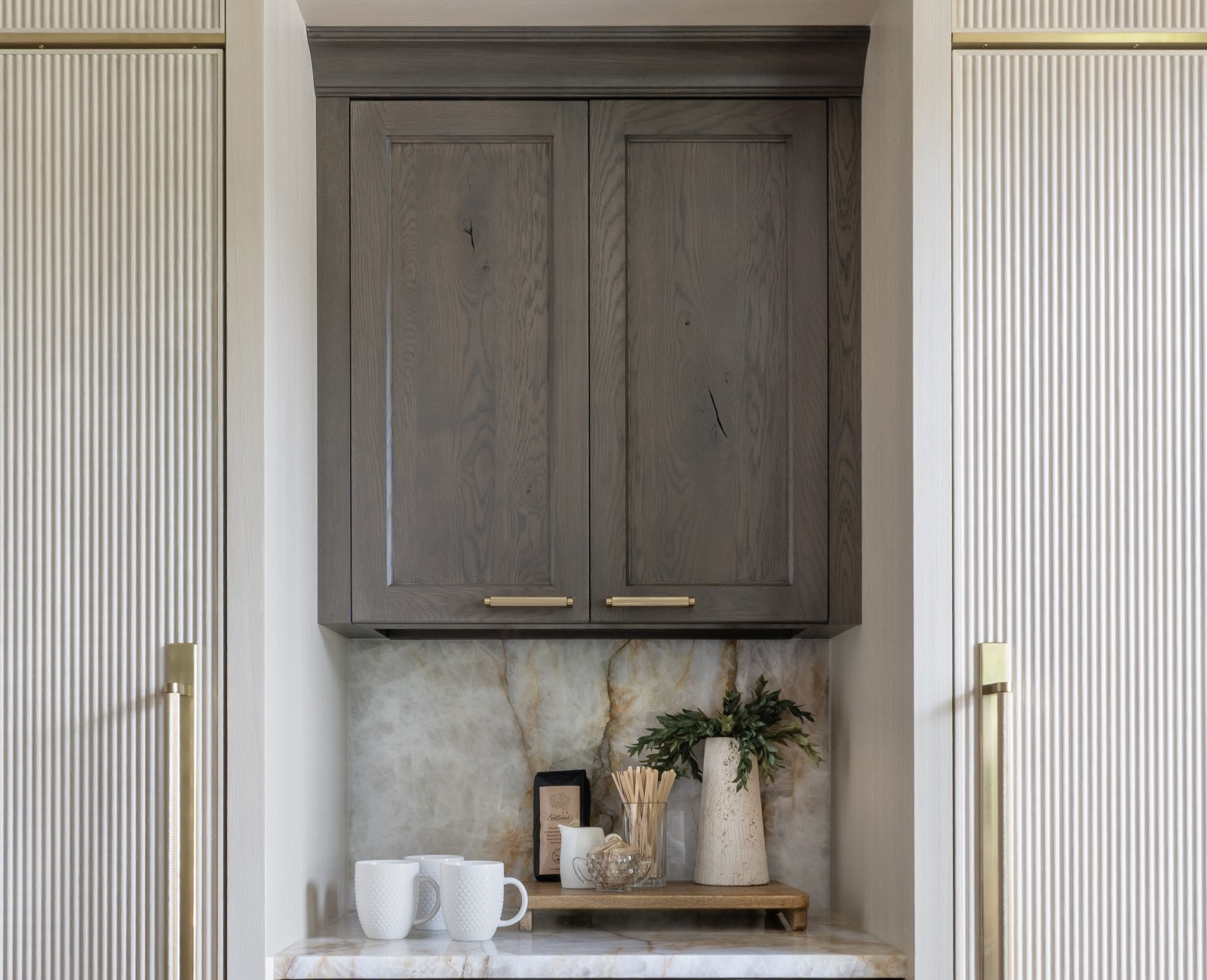 Edmond-kitchen-remodel-coffee-bar-paneled-refrigerator-and-freezer-detail Kitchen remodel with custom knotty oak cabinets placed between reeded paneled appliances