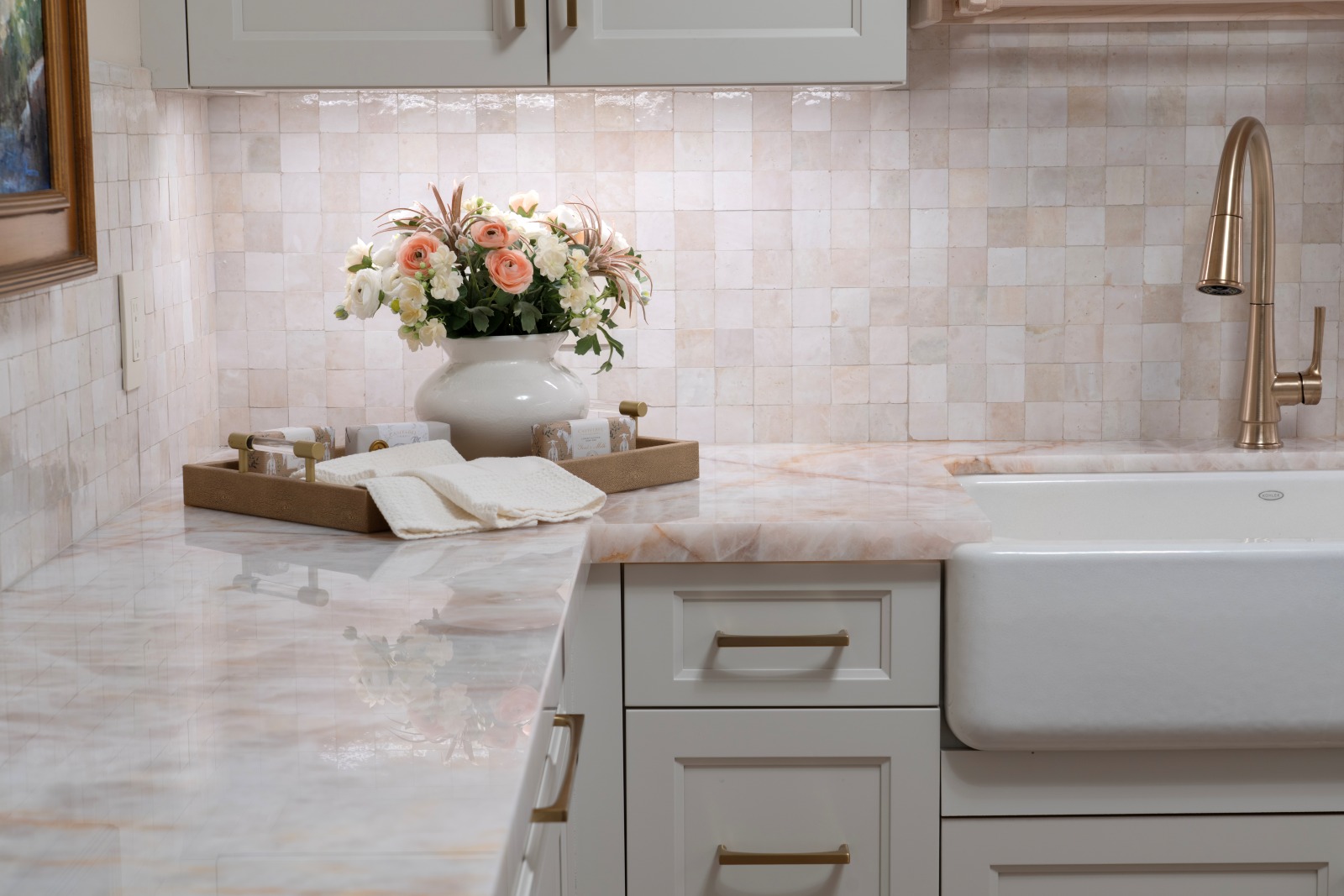 Edmond-laundry-remodel-farm-sink-crystallo-countertop-custom-cabinetry Pink Cristallo laundry room countertop with textured zellige tile backsplash